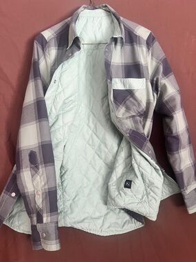 Flylow Gear Reversible Jacket in Pistachio Green/Black and Gray Plaid.